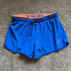 Nike DryFit lined shorts, orange and blue, size Medium